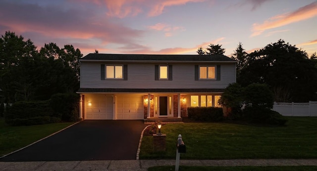 61 Sherwood Ct, Huntington, NY 11743 - traditional home featuring a garage and driveway