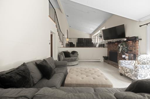 61 Sherwood Ct, Huntington, NY 11743 - living room featuring stairway, lofted ceiling, a baseboard heating unit, and a fireplace