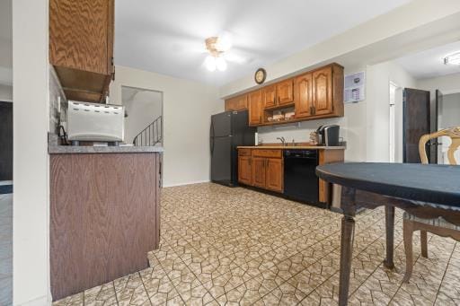 61 Sherwood Ct, Huntington, NY 11743 - kitchen featuring black appliances and brown cabinets