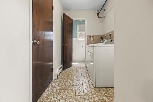 61 Sherwood Ct, Huntington, NY 11743 - laundry area featuring washing machine and dryer and a baseboard heating unit