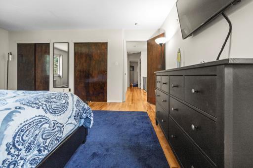 61 Sherwood Ct, Huntington, NY 11743 - bedroom featuring wood finished floors and multiple closets