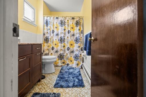 61 Sherwood Ct, Huntington, NY 11743 - full bathroom with vanity, a baseboard heating unit, and a shower with curtain