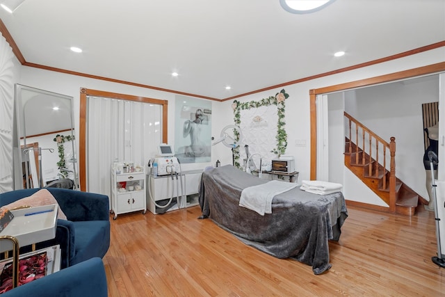 2328 Ellis Ave, Bronx, NY 10462 - living room featuring light wood-style flooring, stairway, crown molding, and recessed lighting