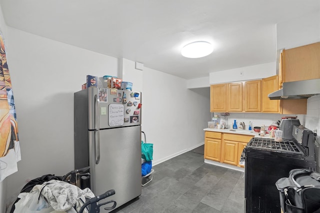 2328 Ellis Ave, Bronx, NY 10462 - kitchen with freestanding refrigerator, under cabinet range hood, black gas range oven, light brown cabinets, and light countertops