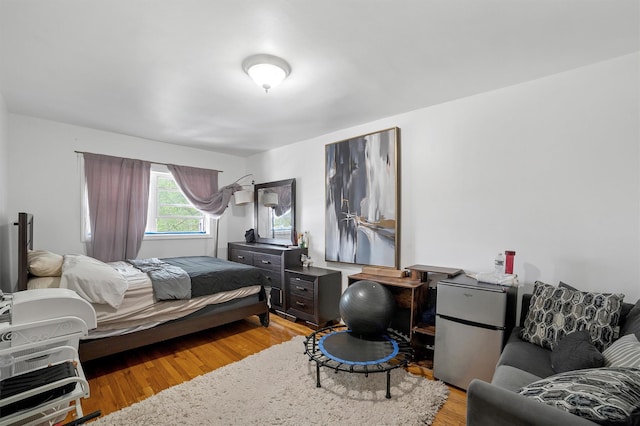 2328 Ellis Ave, Bronx, NY 10462 - bedroom with freestanding refrigerator and light wood finished floors