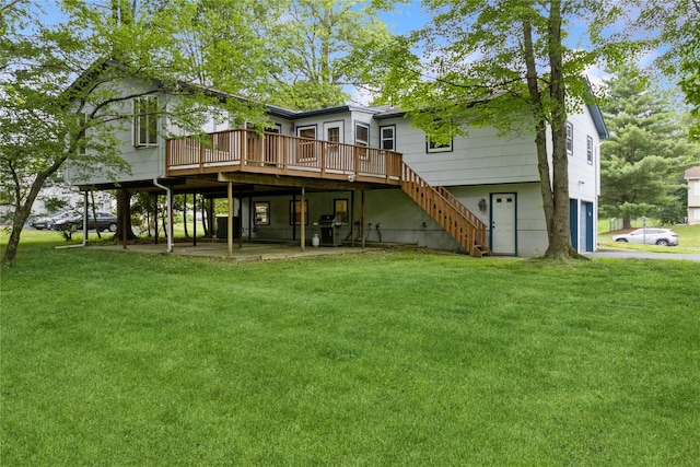 9 Westlyn Dr, Bardonia, NY 10954 - back of property featuring a wooden deck, a lawn, an attached garage, and stairway