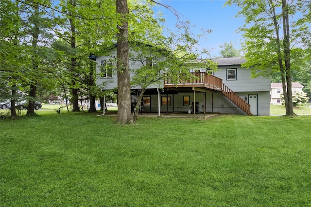 9 Westlyn Dr, Bardonia, NY 10954 - back of property with a deck, a lawn, and stairs