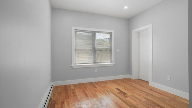 506 E 183rd St, Bronx, NY 10458 - spare room with baseboard heating, light wood-style floors, and recessed lighting