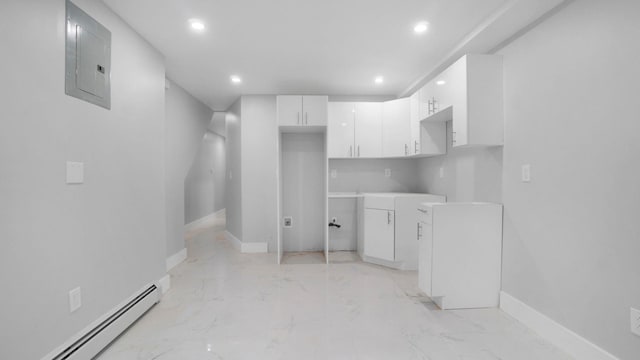 506 E 183rd St, Bronx, NY 10458 - kitchen with baseboard heating, electric panel, recessed lighting, white cabinets, and light marble finish flooring