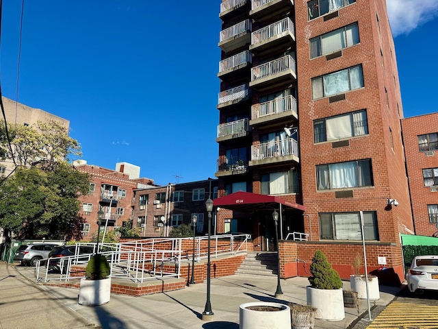 87-14 57th Rd Unit 1A, Elmhurst, NY 11373 - view of apartment building / complex