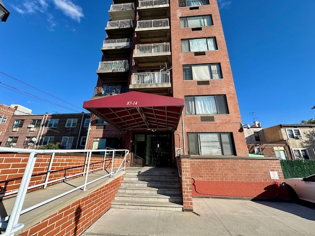87-14 57th Rd Unit 1A, Elmhurst, NY 11373 - view of apartment building / complex