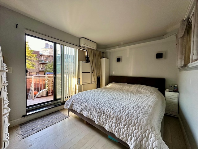 87-14 57th Rd Unit 1A, Elmhurst, NY 11373 - bedroom with freestanding refrigerator, wood finished floors, and an AC wall unit