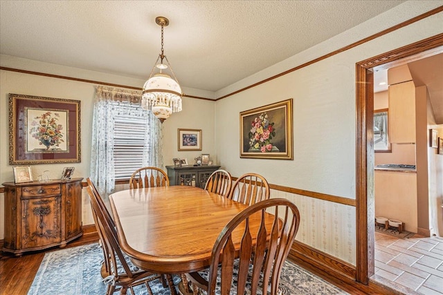 163-50 25th Dr, Flushing, NY 11358 - dining area featuring a chandelier, a textured ceiling, and wood finished floors