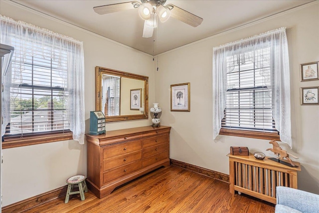 163-50 25th Dr, Flushing, NY 11358 - living area featuring wood finished floors, ceiling fan, and crown molding