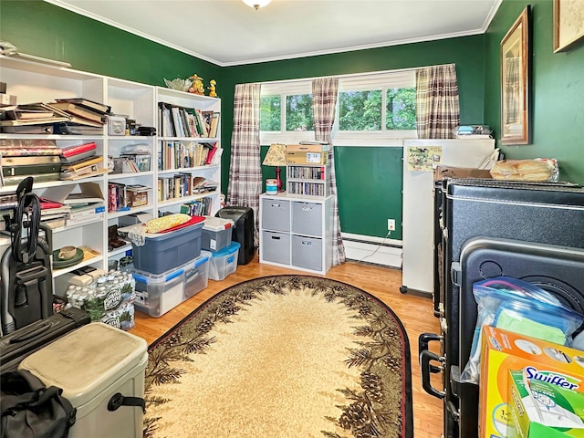 222 Beechwood Ave, Poughkeepsie, NY 12601 - bedroom with ornamental molding, baseboard heating, and wood finished floors