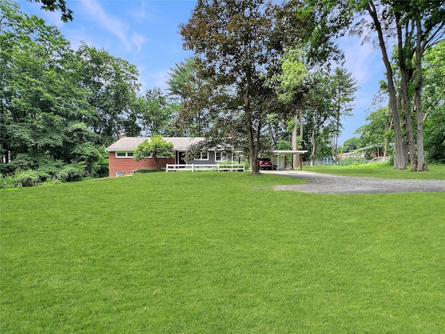 222 Beechwood Ave, Poughkeepsie, NY 12601 - view of grassy yard featuring a carport and driveway