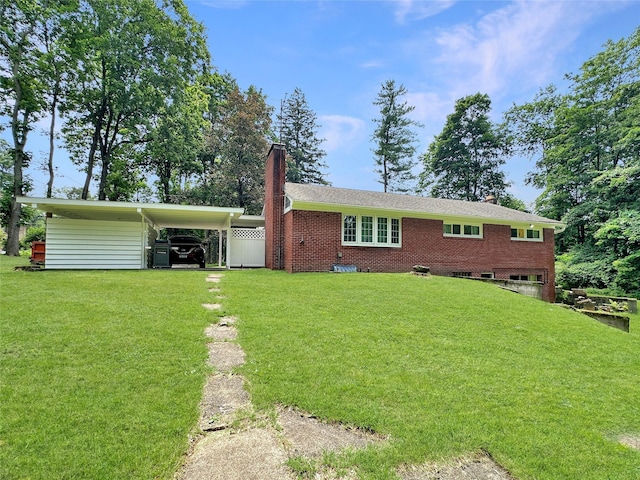 222 Beechwood Ave, Poughkeepsie, NY 12601 - back of house featuring a chimney, a lawn, brick siding, and a garage