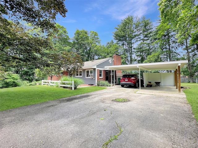222 Beechwood Ave, Poughkeepsie, NY 12601 - single story home with a chimney, driveway, a front yard, and a carport