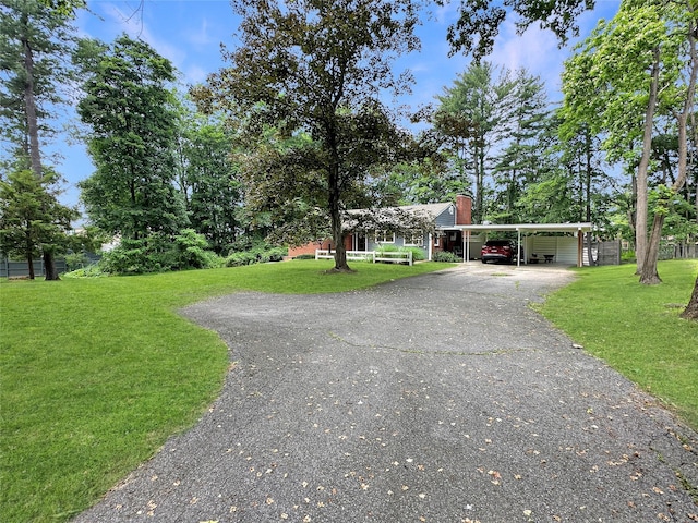222 Beechwood Ave, Poughkeepsie, NY 12601 - view of front of home featuring a chimney, a front lawn, and asphalt driveway