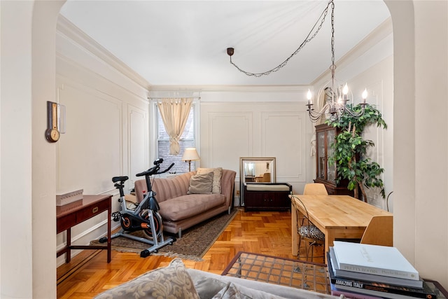 4204 64th St, Woodside, NY 11377 - living room featuring ornamental molding, arched walkways, and a chandelier