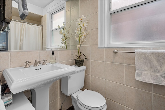 4204 64th St, Woodside, NY 11377 - full bathroom featuring tile walls, healthy amount of natural light, and backsplash
