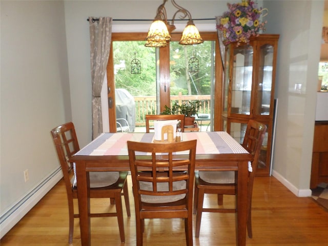 6 Kingsville Dr, Monroe, NY 10950 - dining room with baseboard heating, light wood-style flooring, and a chandelier