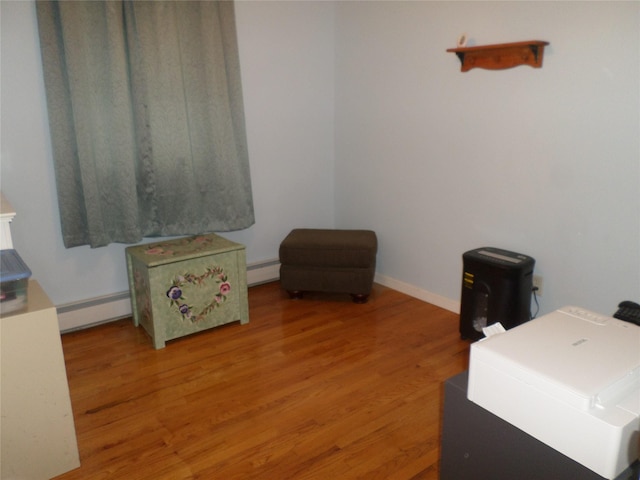 6 Kingsville Dr, Monroe, NY 10950 - office space featuring a baseboard radiator, a baseboard heating unit, and light wood-type flooring