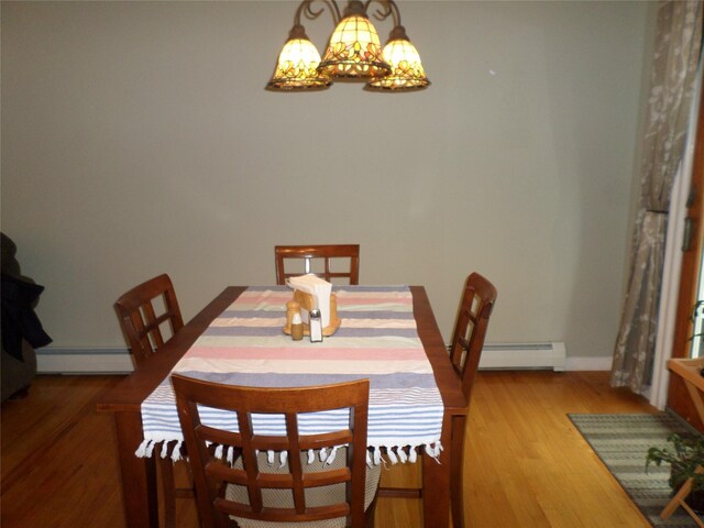 6 Kingsville Dr, Monroe, NY 10950 - dining room with a baseboard radiator, a chandelier, a baseboard heating unit, and light wood finished floors