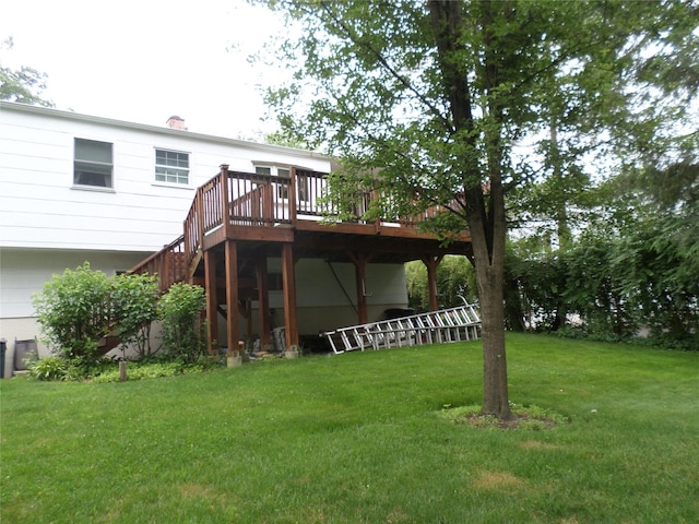6 Kingsville Dr, Monroe, NY 10950 - back of property featuring a deck, a lawn, stairs, and a chimney