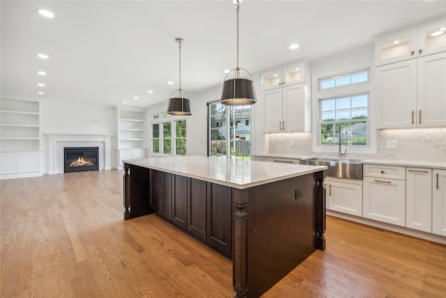 96A Calvin Ave, Syosset, NY 11791 - kitchen with a center island, plenty of natural light, light wood-type flooring, and recessed lighting