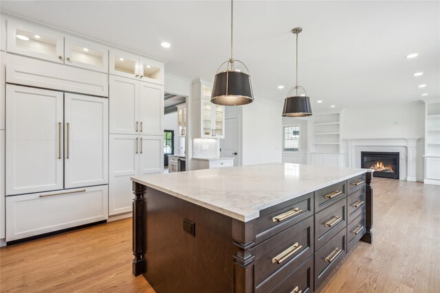 96A Calvin Ave, Syosset, NY 11791 - kitchen featuring white cabinets, light wood-style flooring, decorative light fixtures, light stone counters, and recessed lighting