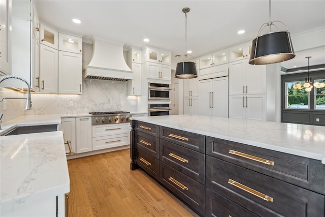 96A Calvin Ave, Syosset, NY 11791 - kitchen with premium range hood, white cabinets, stainless steel appliances, recessed lighting, and crown molding