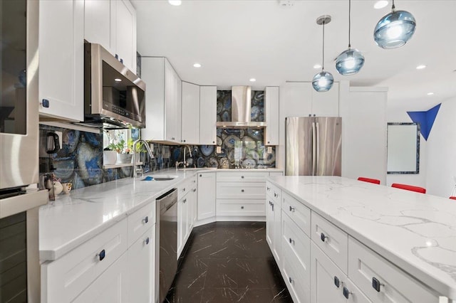 740 Eagle Dr, North Woodmere, NY 11581 - kitchen with stainless steel appliances, backsplash, light stone countertops, white cabinetry, and recessed lighting