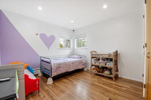 740 Eagle Dr, North Woodmere, NY 11581 - bedroom featuring wood finished floors, a baseboard radiator, and recessed lighting