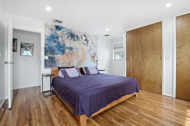 740 Eagle Dr, North Woodmere, NY 11581 - bedroom featuring wood finished floors and recessed lighting