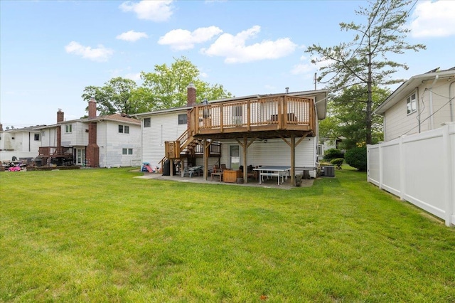 740 Eagle Dr, North Woodmere, NY 11581 - back of house featuring a wooden deck, stairs, a patio area, and a chimney
