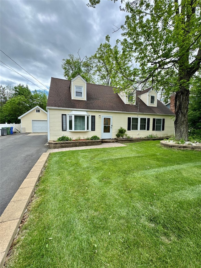 21 Maple Dr, Middletown, NY 10940 - cape cod house featuring an outbuilding, a garage, a front lawn, and roof with shingles