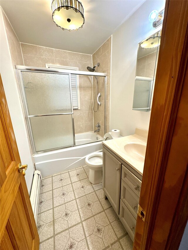 21 Maple Dr, Middletown, NY 10940 - bathroom featuring vanity, enclosed tub / shower combo, a baseboard heating unit, and tile patterned floors