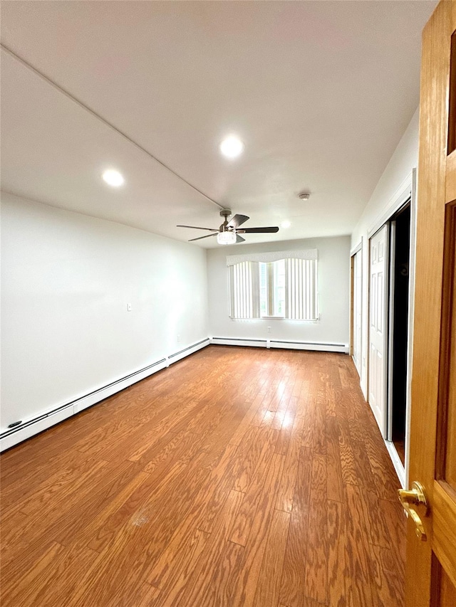 21 Maple Dr, Middletown, NY 10940 - unfurnished room with recessed lighting, a ceiling fan, wood finished floors, and a baseboard radiator