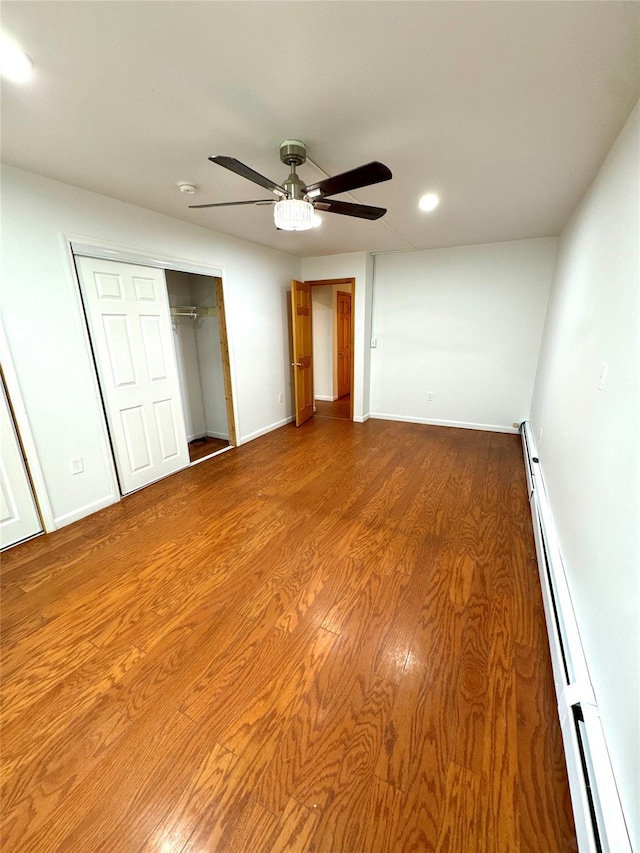 21 Maple Dr, Middletown, NY 10940 - unfurnished bedroom featuring a baseboard radiator, recessed lighting, a closet, wood finished floors, and ceiling fan