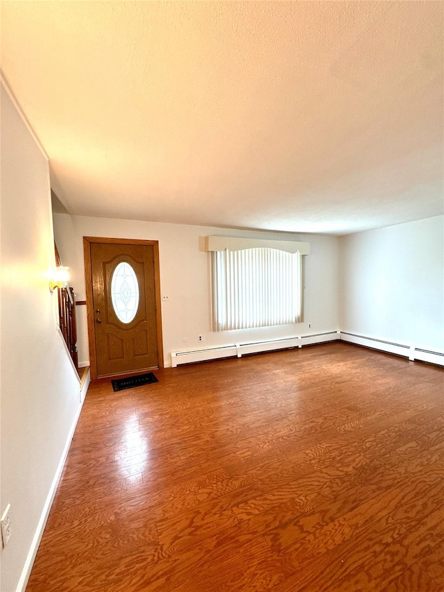 21 Maple Dr, Middletown, NY 10940 - entrance foyer with wood finished floors and a textured ceiling