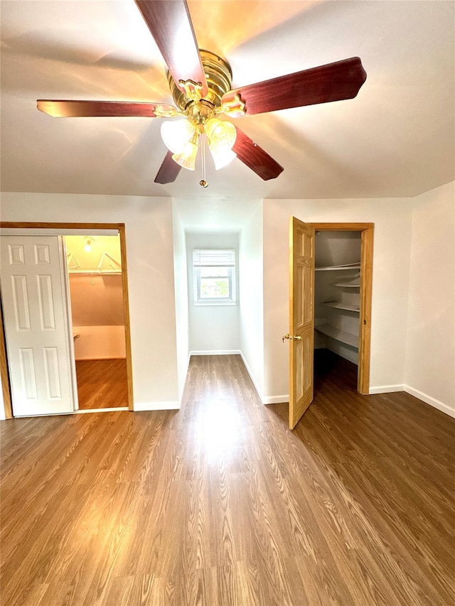 21 Maple Dr, Middletown, NY 10940 - unfurnished bedroom featuring a spacious closet, a closet, wood finished floors, and a ceiling fan