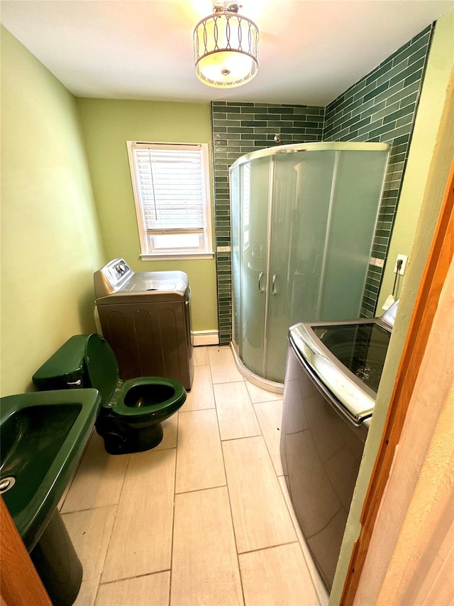 21 Maple Dr, Middletown, NY 10940 - full bath with independent washer and dryer, a stall shower, and tile patterned flooring