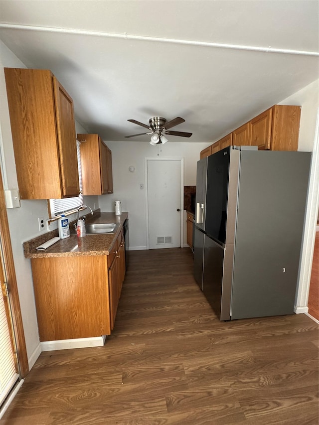 21 Maple Dr, Middletown, NY 10940 - kitchen with stainless steel fridge with ice dispenser, brown cabinetry, dark wood-style floors, ceiling fan, and dark countertops