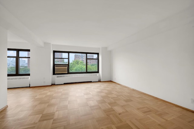 21-15 34th Ave Unit 8B, Astoria, NY 11106 - empty room with radiator heating unit