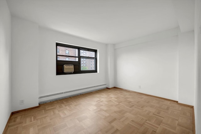 21-15 34th Ave Unit 8B, Astoria, NY 11106 - spare room featuring a baseboard heating unit and cooling unit