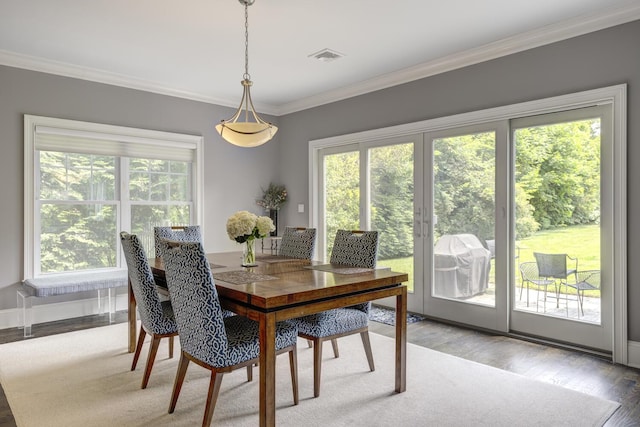 28 Weir Ln, Locust Valley, NY 11560 - dining room featuring crown molding and wood finished floors
