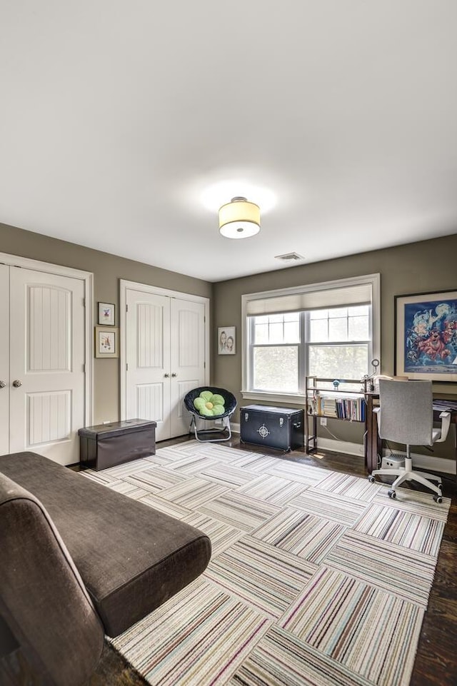 28 Weir Ln, Locust Valley, NY 11560 - bedroom with a desk, multiple closets, and carpet