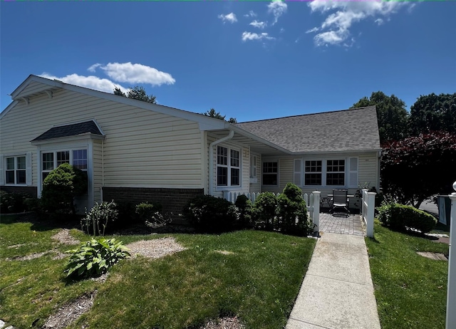 60 Revere Dr, Sayville, NY 11782 - view of front of house with a front yard and a shingled roof