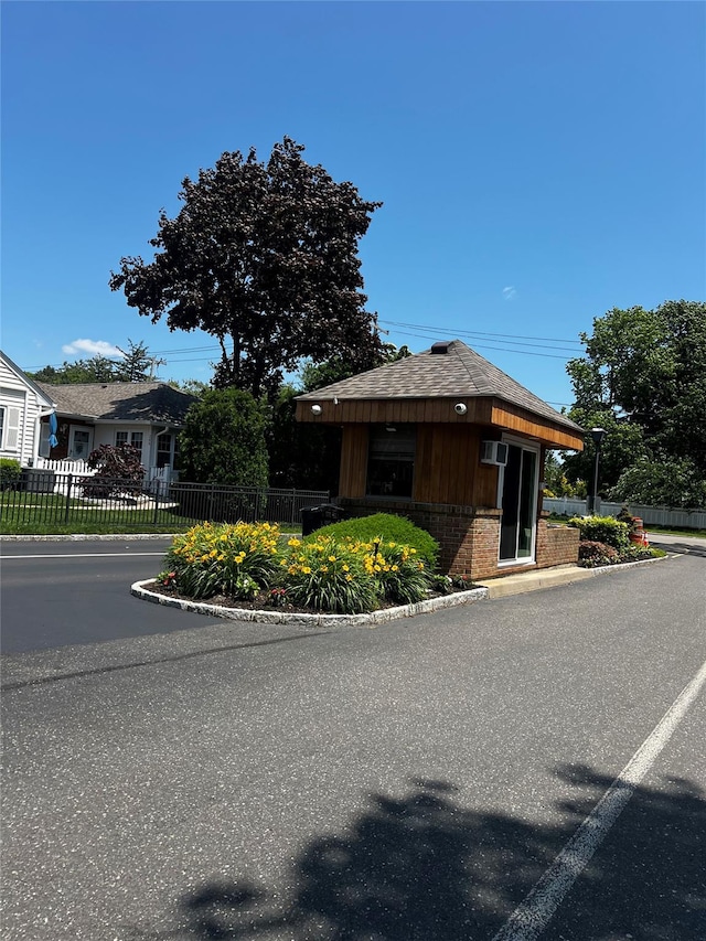 60 Revere Dr, Sayville, NY 11782 - view of front of home with brick siding and roof with shingles
